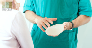 Surgeon Holding an Implant