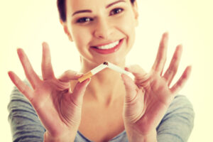 woman breaking cigarette